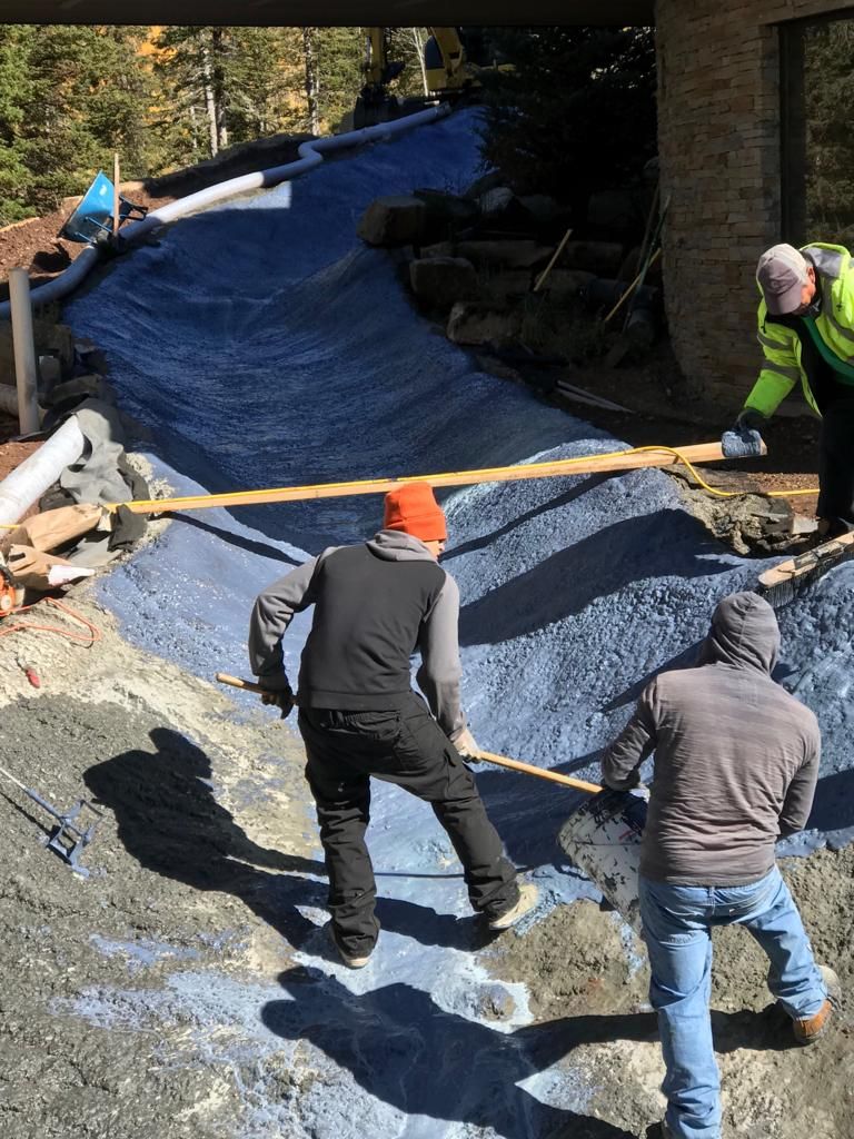 Crew installing drainage base material