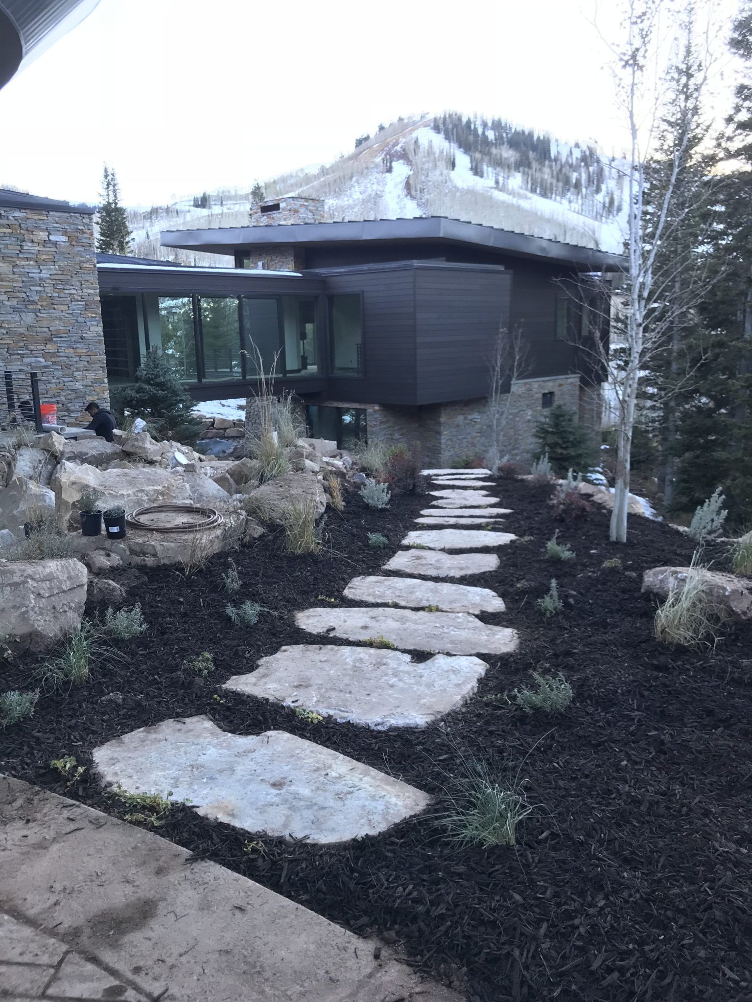 Flagstone stepping path beside a modern home